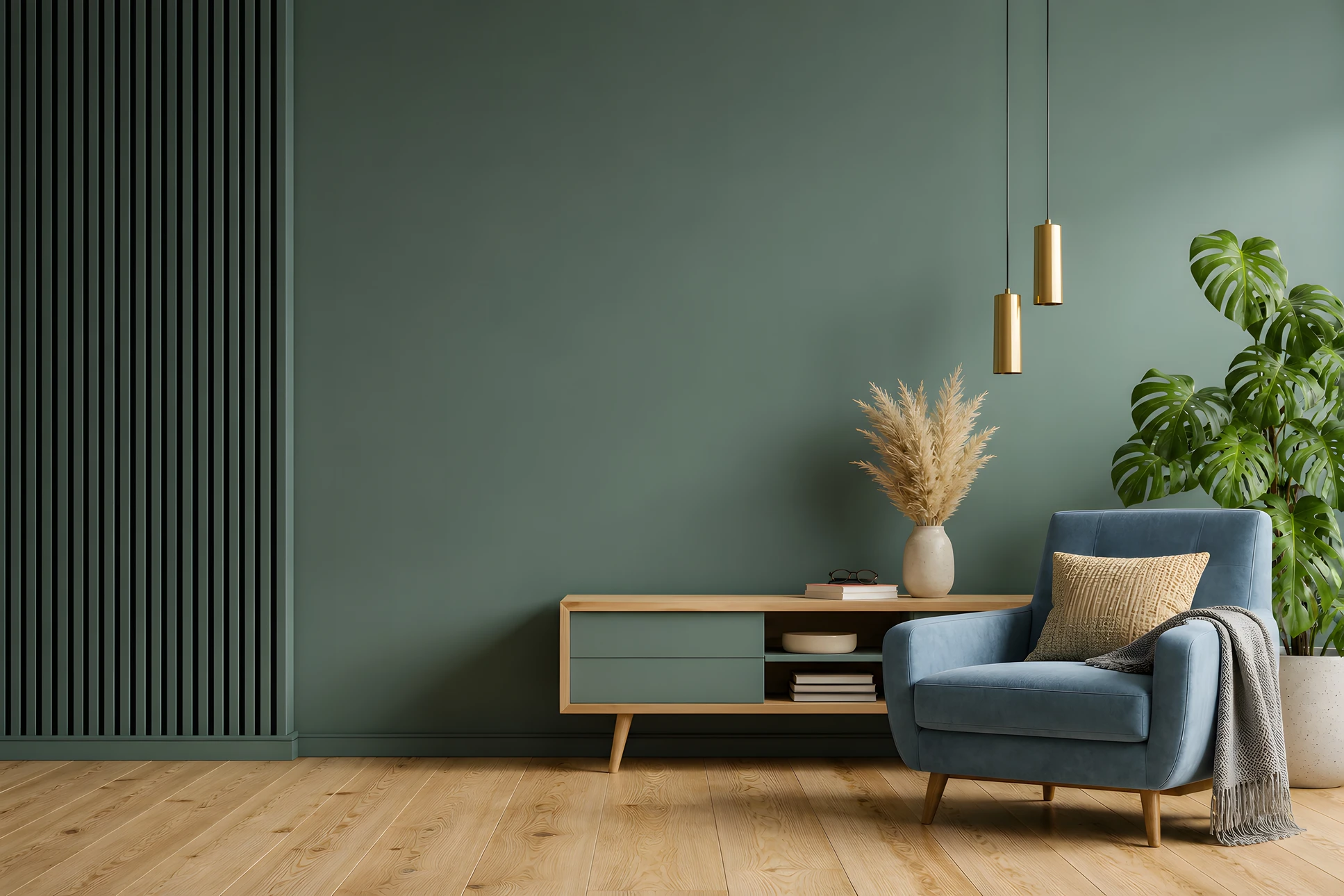 Une main tient un pinceau plat à manche vert chargé de peinture orange au-dessus d'un pot de peinture blanc ouvert